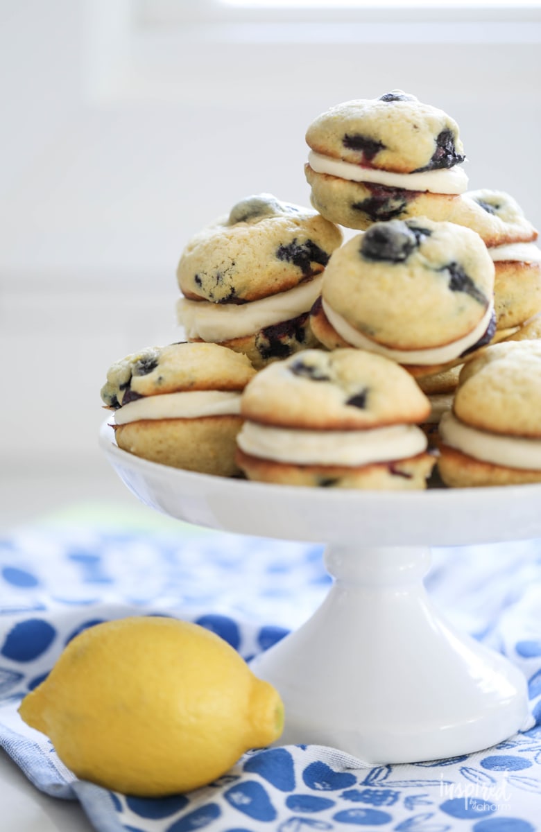 Filled with a lemon cream cheese filling and bursting with lemon zest and fresh blueberries, these Blueberry Lemon Whoopie Pies are a delicious dessert. #lemon #blueberry #whoopiepies #recipe 