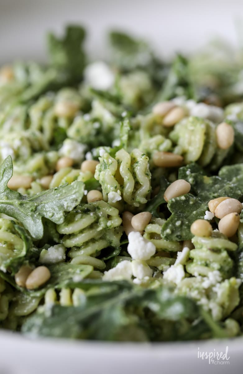 close up of Pine Nut and Arugula Pesto Pasta Salad in a bowl.