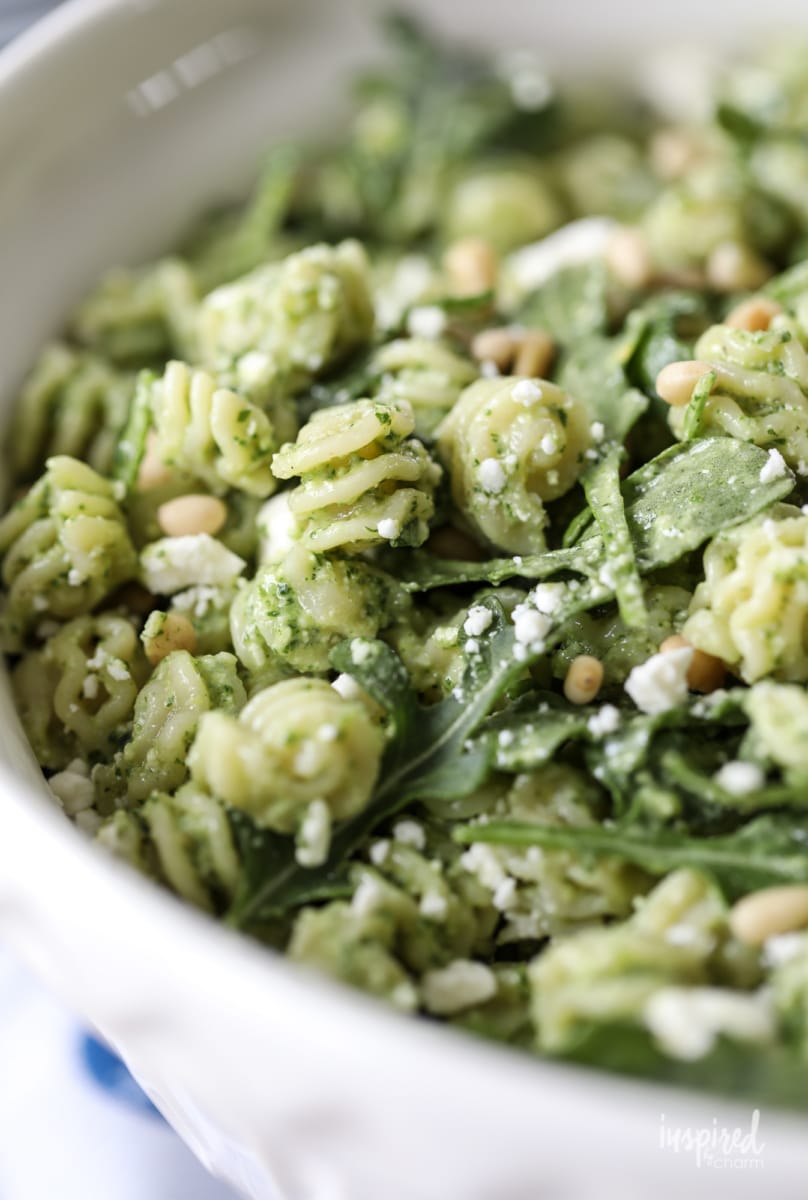 close up of Pine Nut and Arugula Pesto Pasta Salad in a bowl.