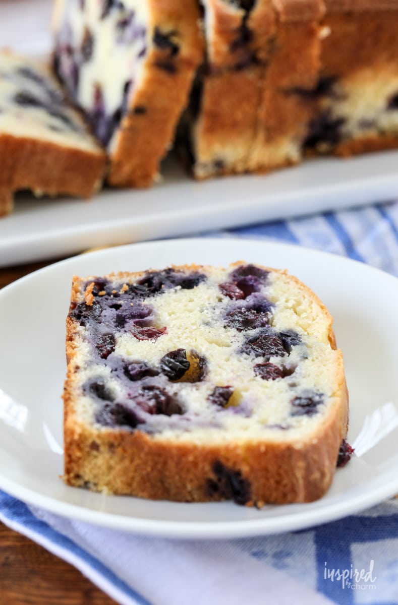 a piece of lemon blueberry quick bread on a plate