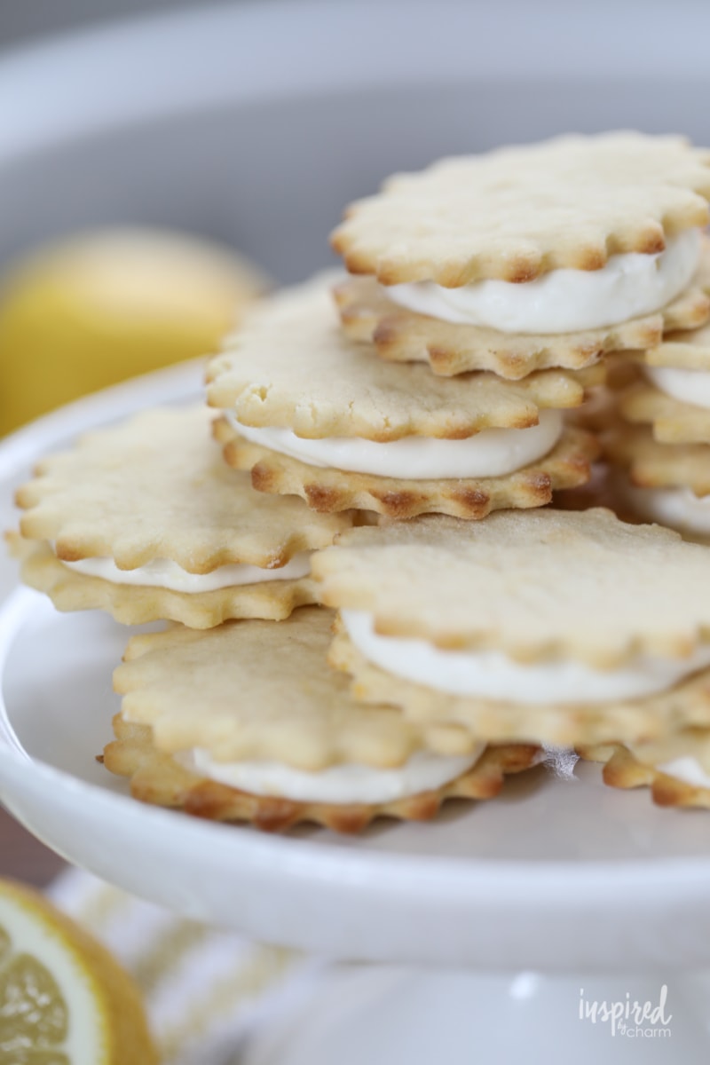 lemon cookies on a cake stand.