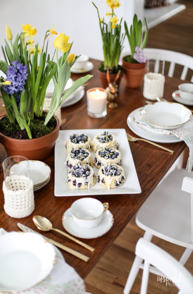 Homemade Blueberry Shortcakes on a dining table decorated for spring. 