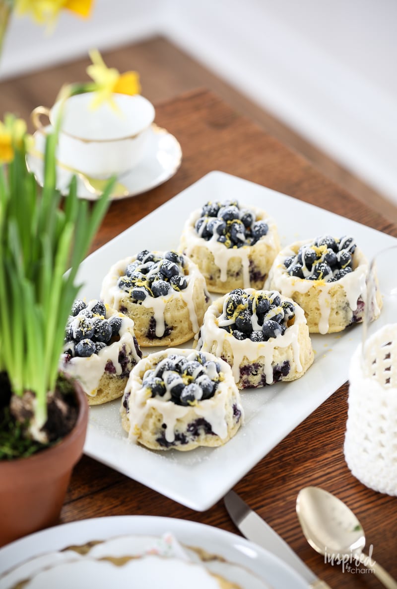 Homemade Blueberry Shortcakes on a white platter on a table. 