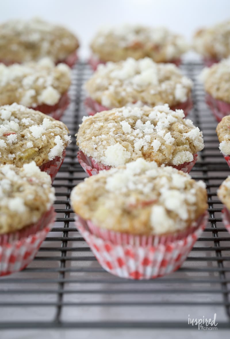 rhubarb muffins with streusel topping on a cooling rack.