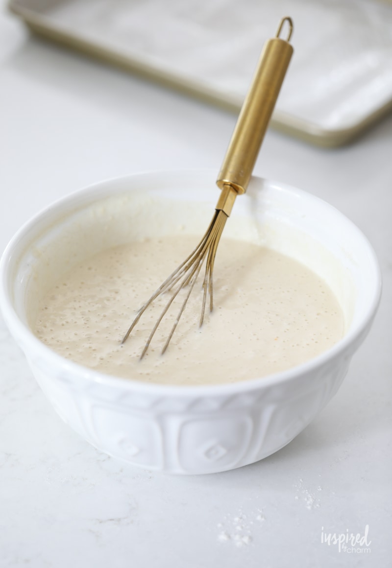pancake mix batter with whisk in bowl.