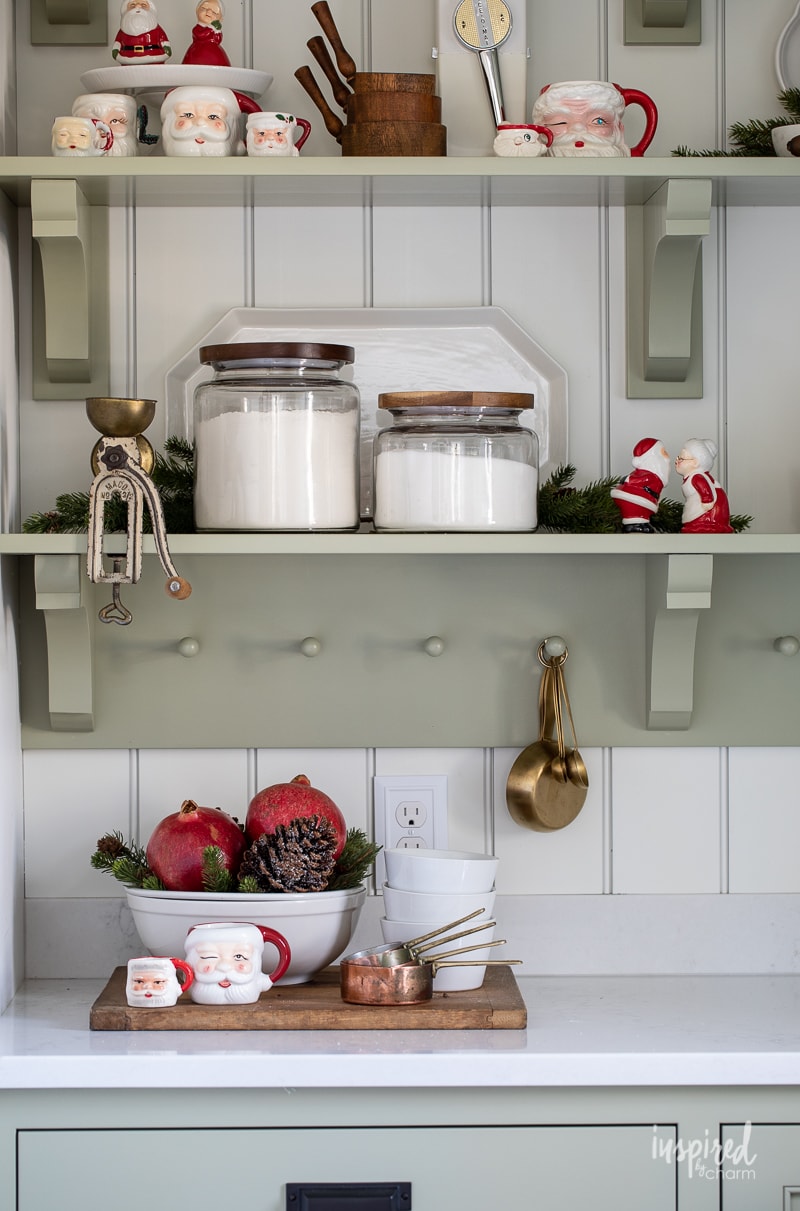 Christmas In my Bulters Pantry on open shelves painted with Sherwin-Williams sage.