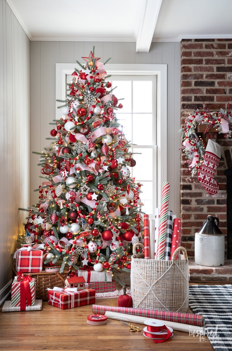 heavily decorated red and white Christmas tree