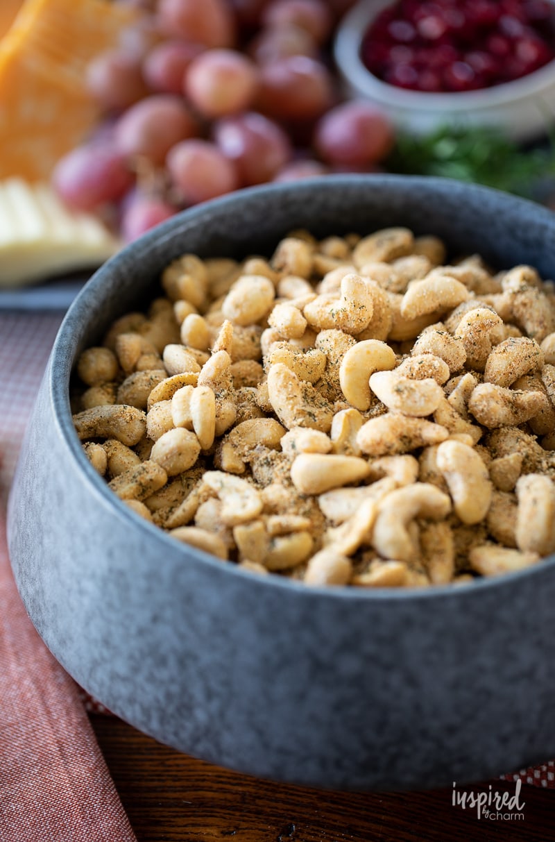 spiced cashews snack mix in a metal dish