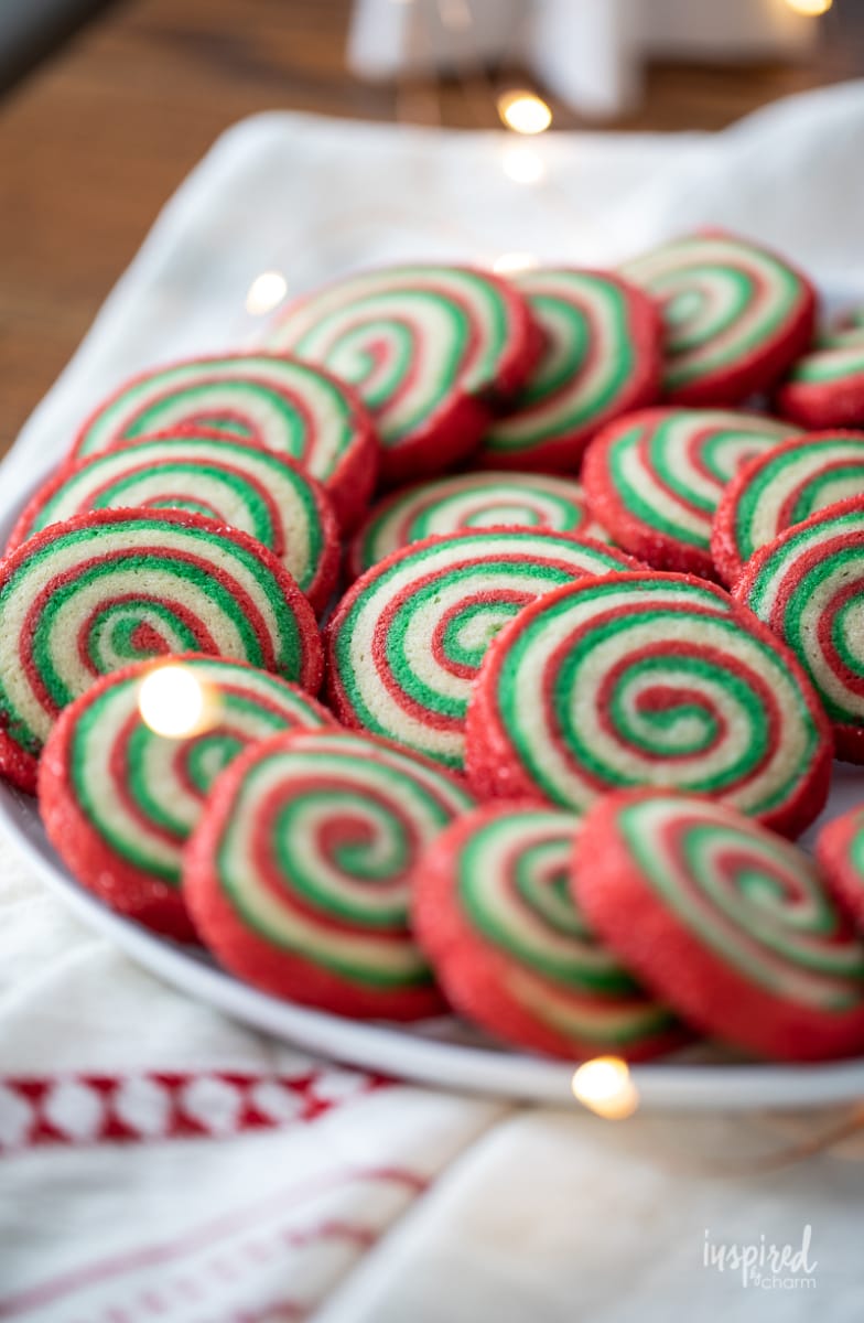 red and green Christmas Pinwheel Cookies on a plate.