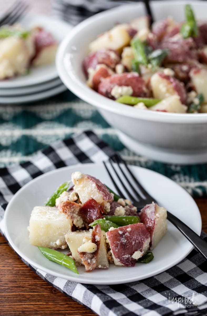 Bacon and Blue Cheese Potato Salad on a plate with a fork. 