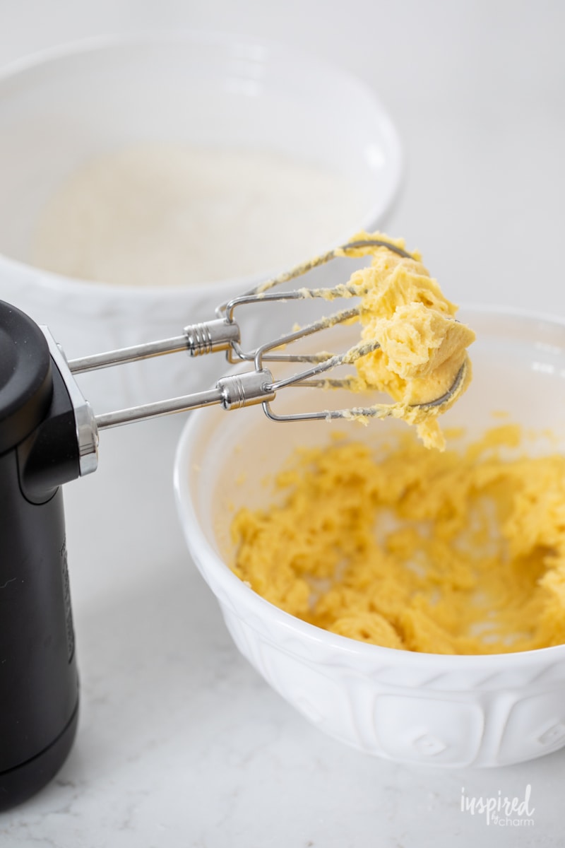 mixing together butter, sugar and egg yolks