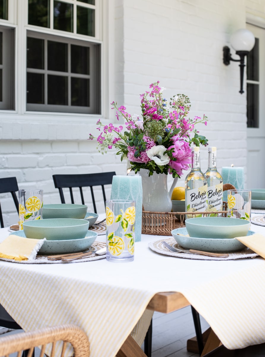 outdoor table setting with flower arrangement.