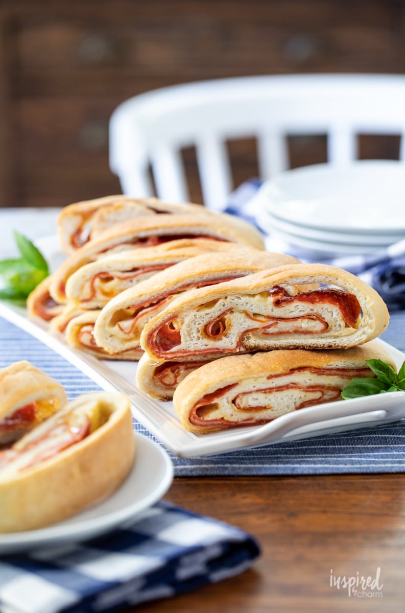pizza style snack rolls on a tray