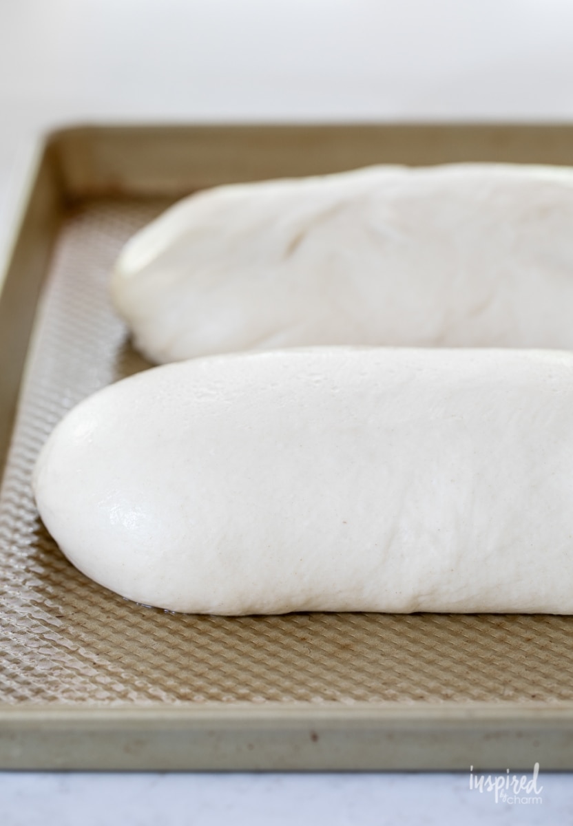 frozen white loaves thawing on a pan