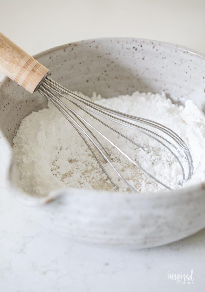 powdered sugar being whisked in a bowl