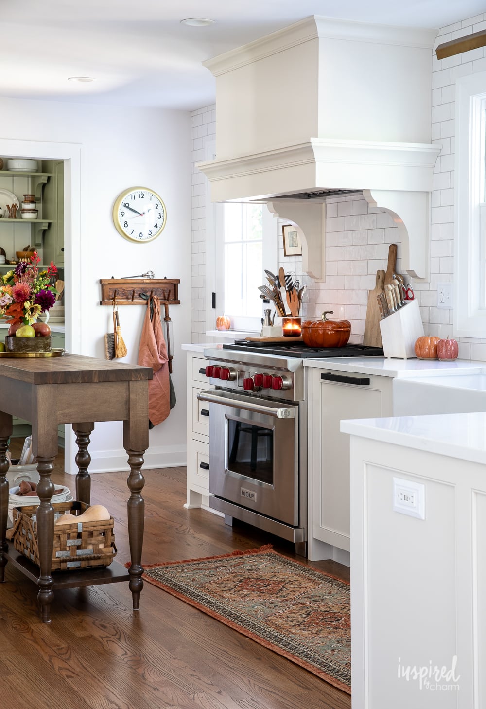 kitchen decorated with fall with cabinetry painted egret white.