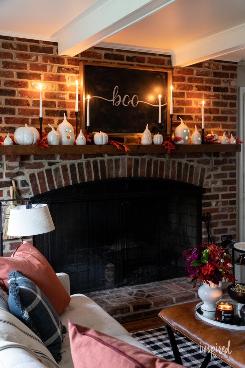 ghost decor along a fireplace mantle