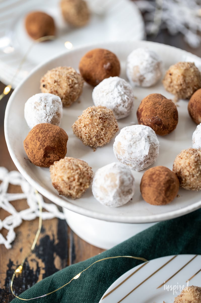 bourbon balls on a plate coated in different ingredients