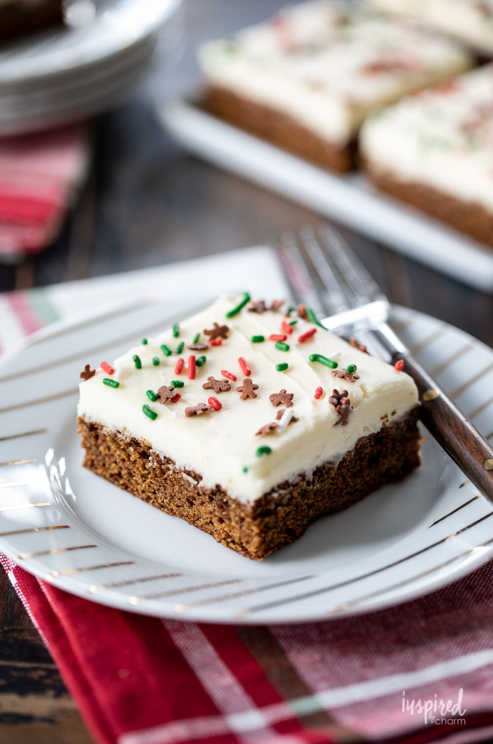 Gingerbread Cookie Bar served on a plate with a fork and napkin.