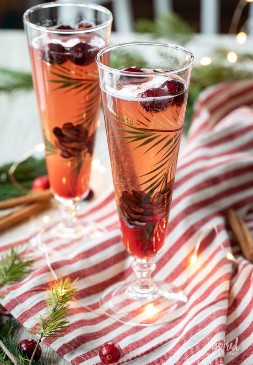 Festive Cranberry Champagne Cocktail in tall glasses.