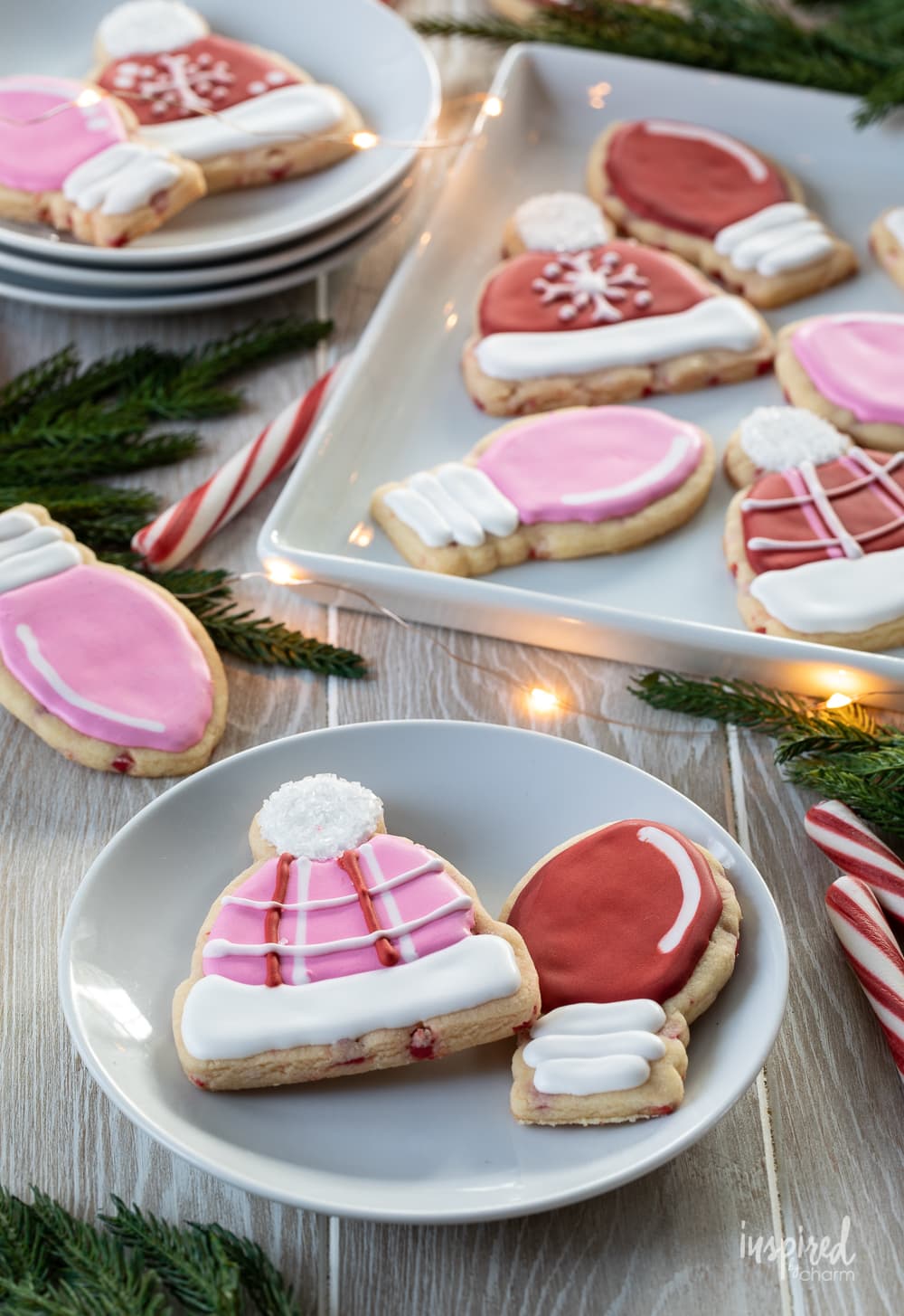 Peppermint Sugar Cookies on a plate and platter garnished with candy cane sticks.