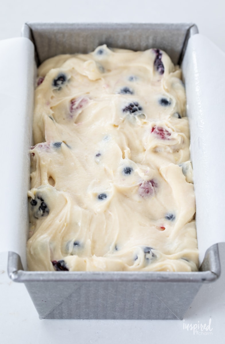 mixed berry pound cake batter in pan