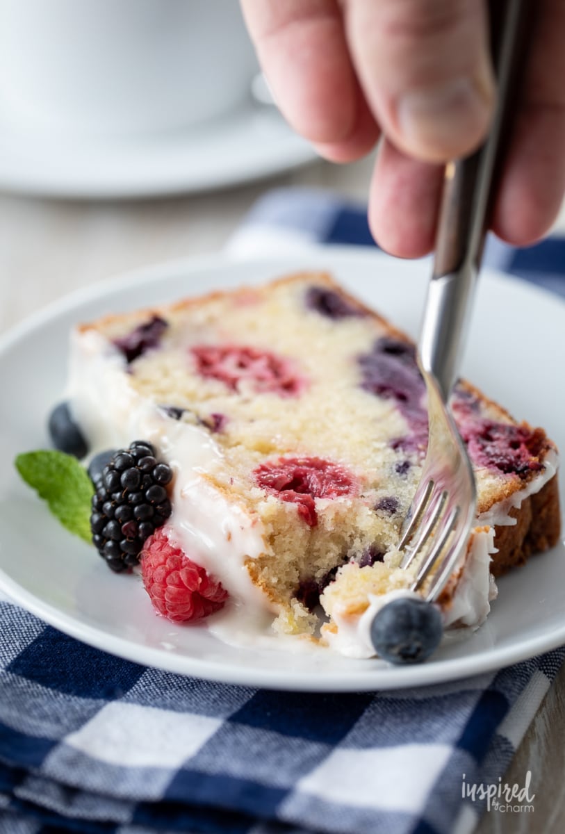 fork in mixed berry pound cake