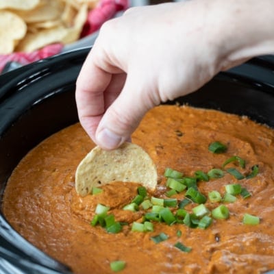 dipping in Hot Chili Cheese Dip