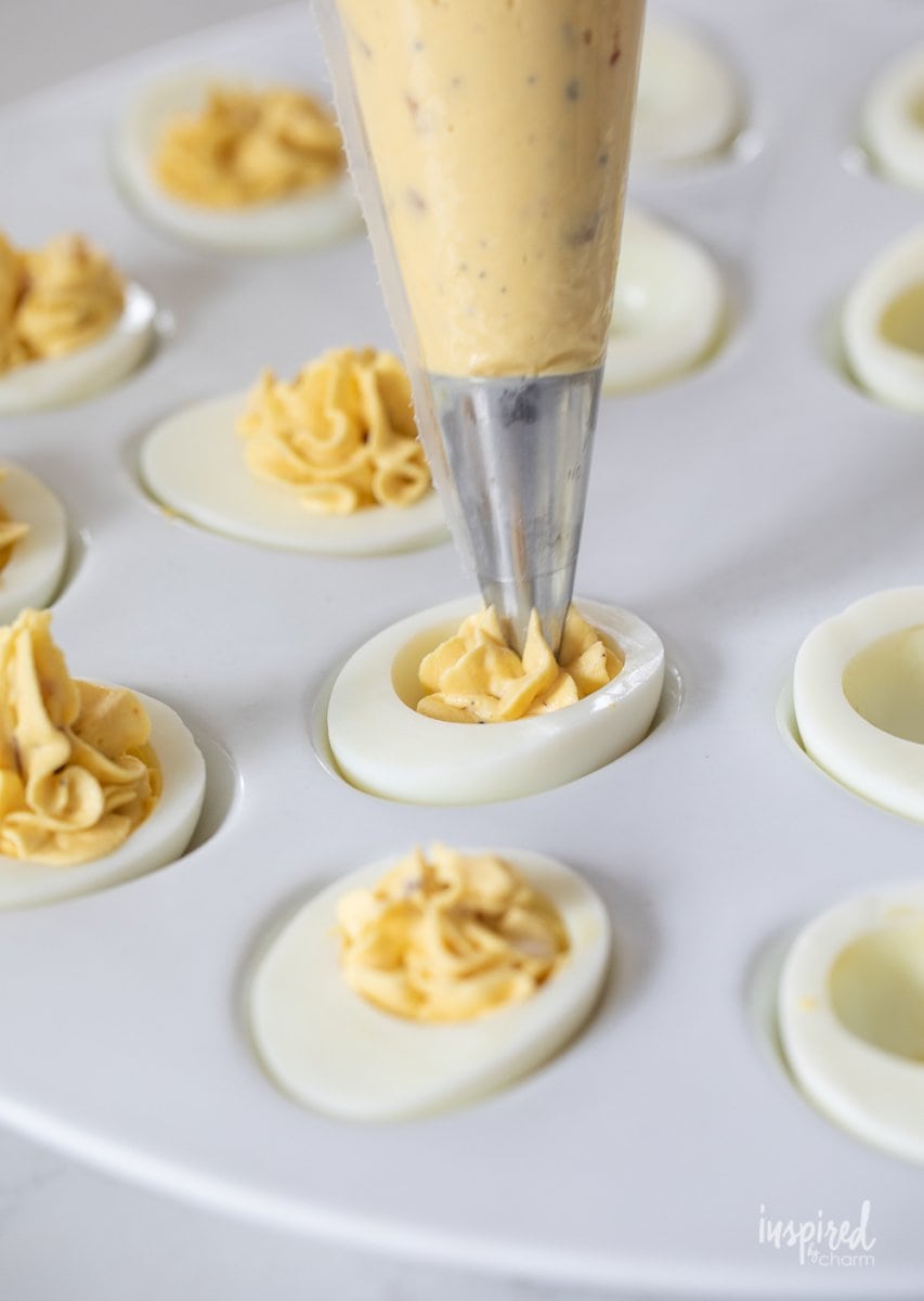 piping into deviled eggs