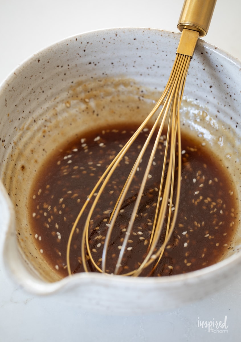teriyaki dressing in a bowl with whisk