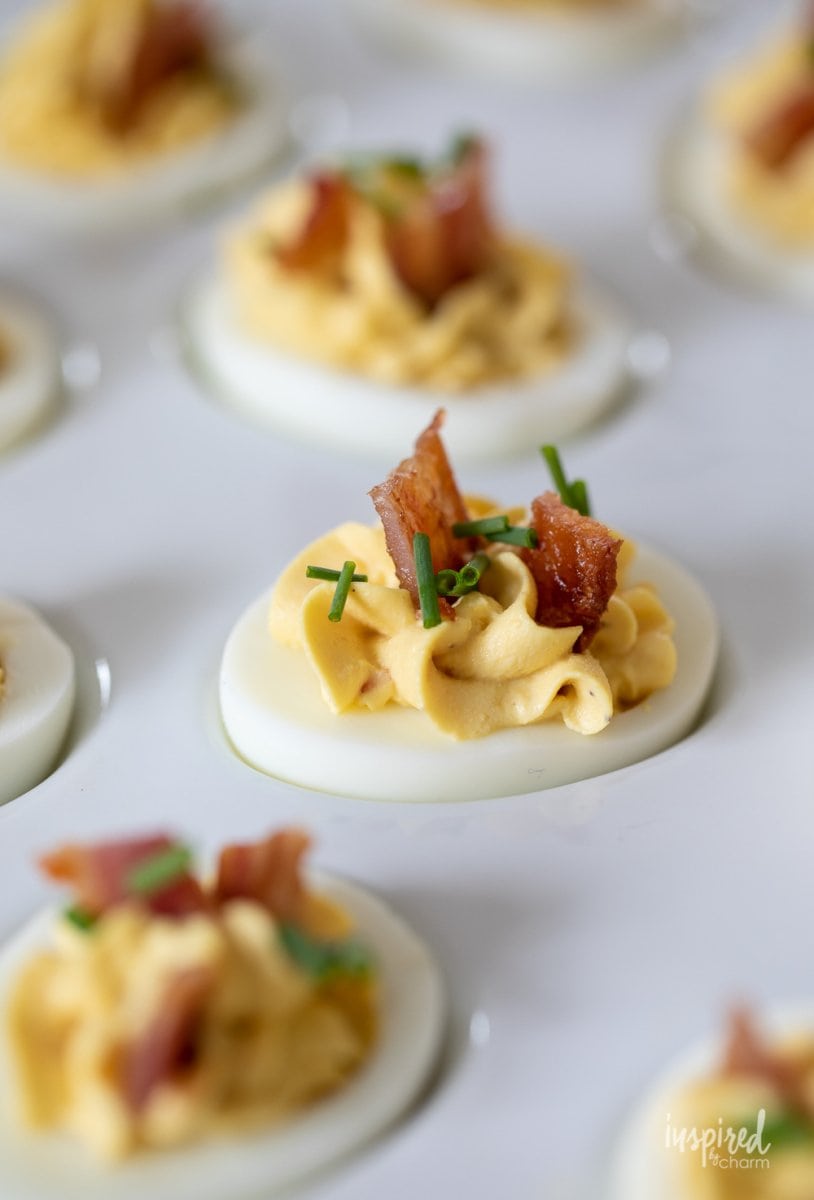 deviled egg with bacon on top
