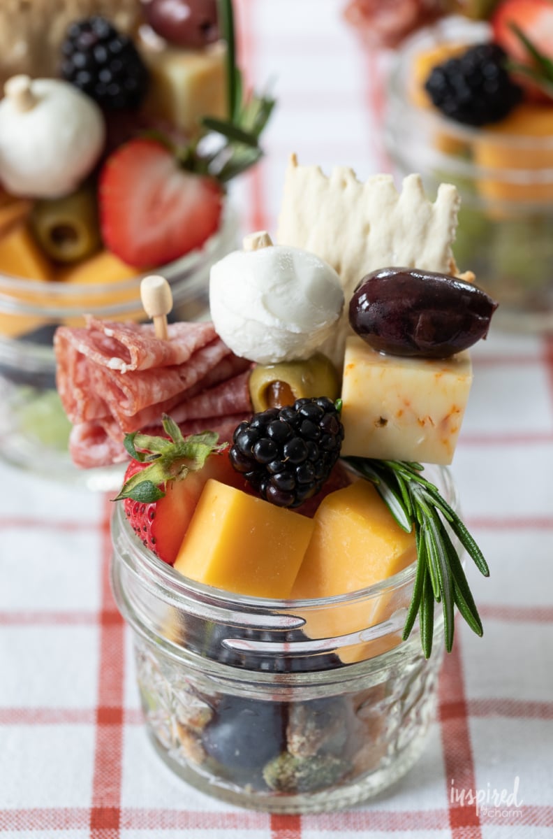 Jarcuterie filled with meats cheese and fruit
