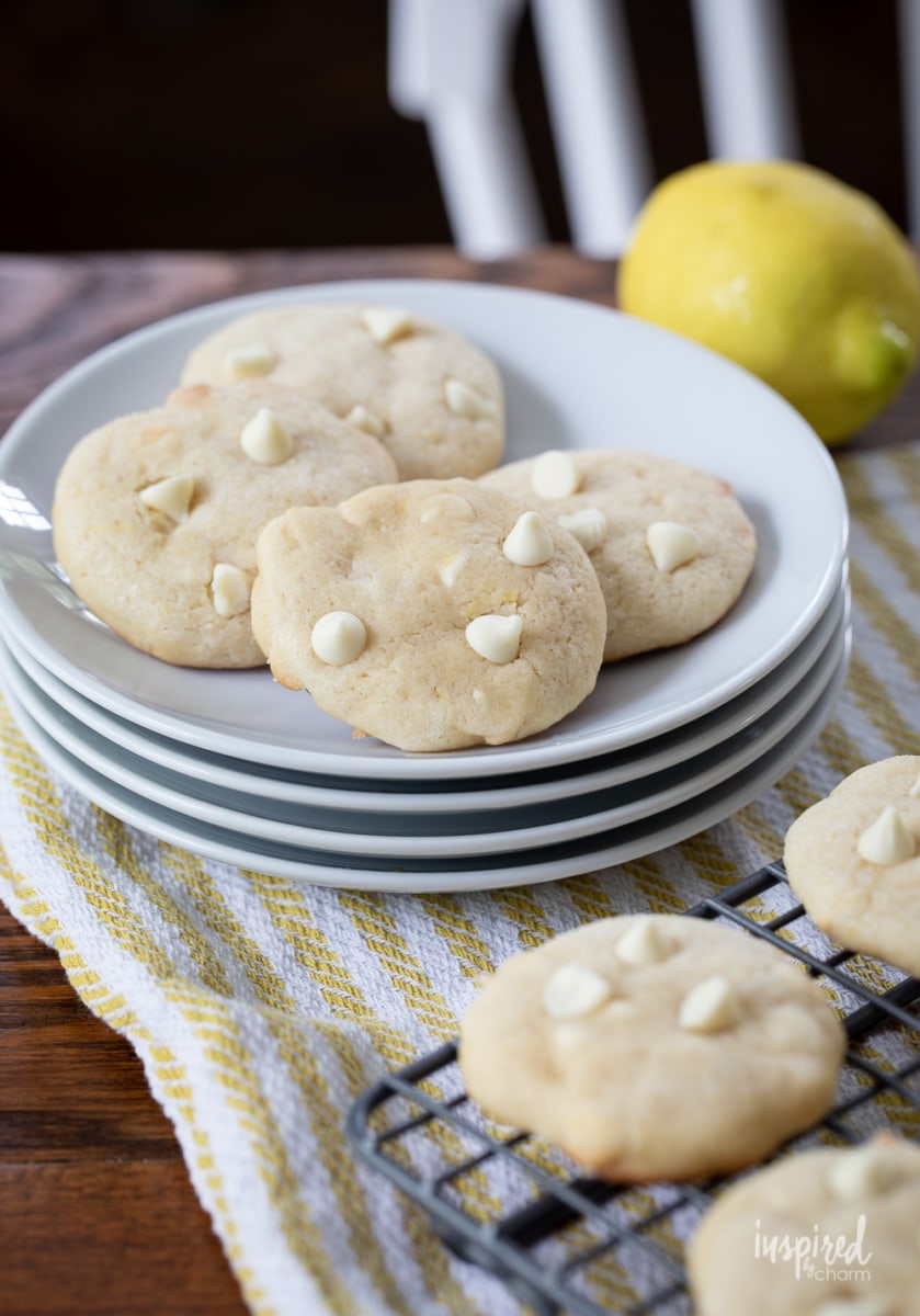 lemon cookies with white chocolate chips on a plate.