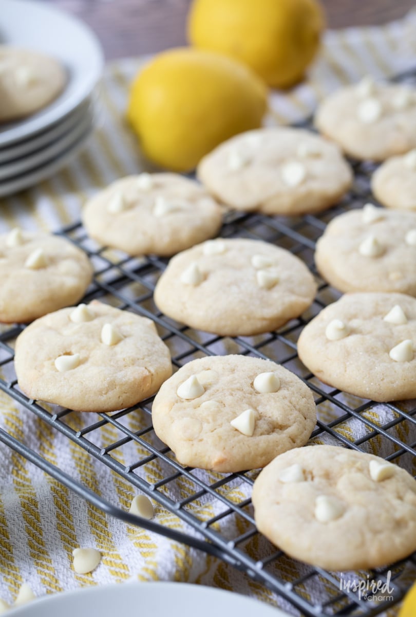 lemon cookies with white chocolate chips on a cooling rack.