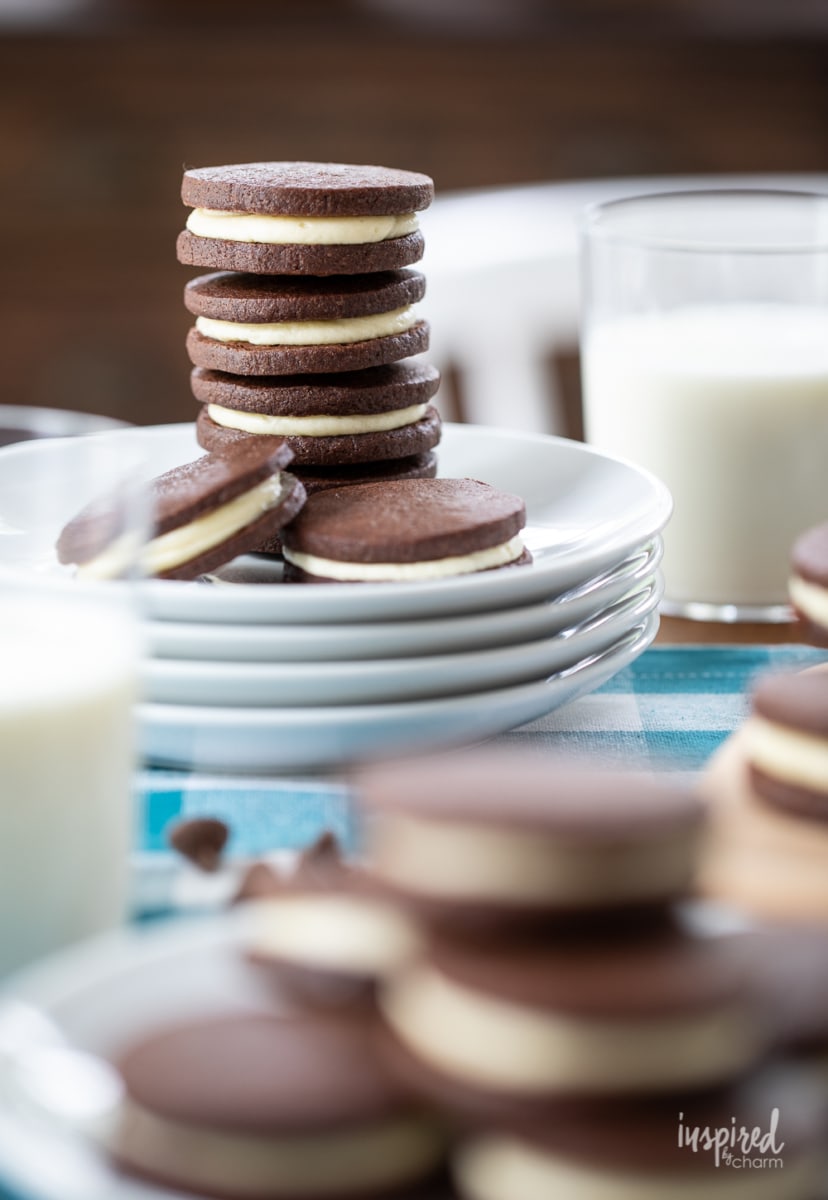 homemade oreos stacked on plate.