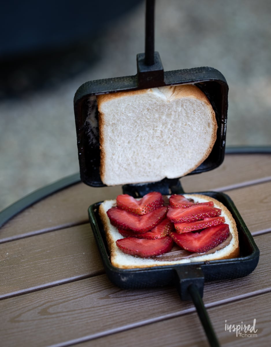 strawberries nutella on bread in pie iron.
