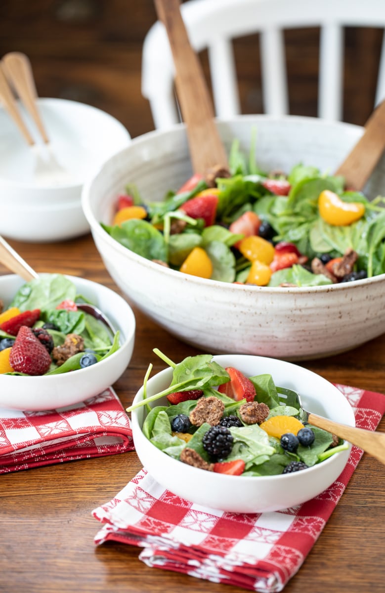 big bowl of spinach salad with berries.