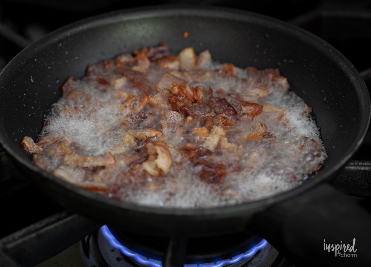 cooking bacon in a pan.