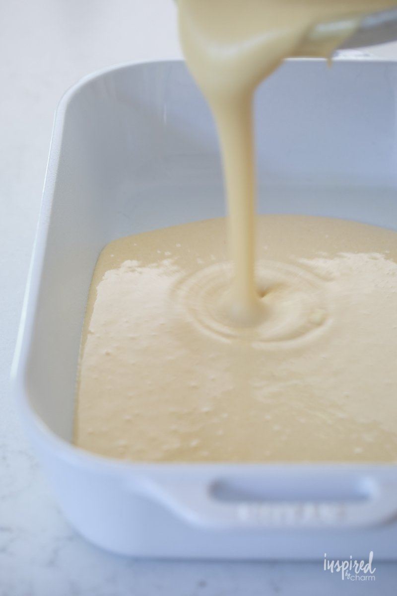 cake batter pouring into pan.