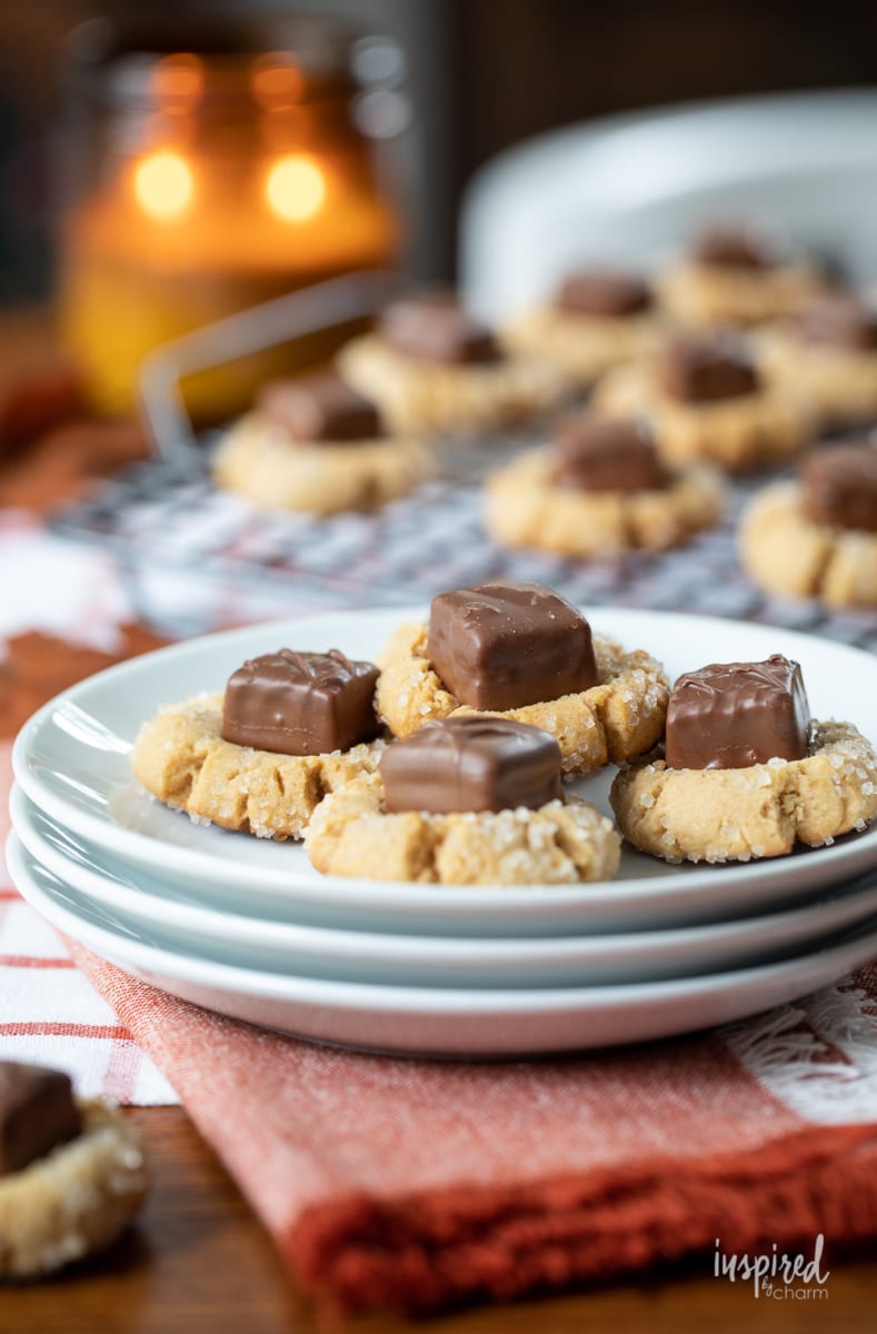 Peanut Butter Candy Bar Cookies on plate and cooling rack.