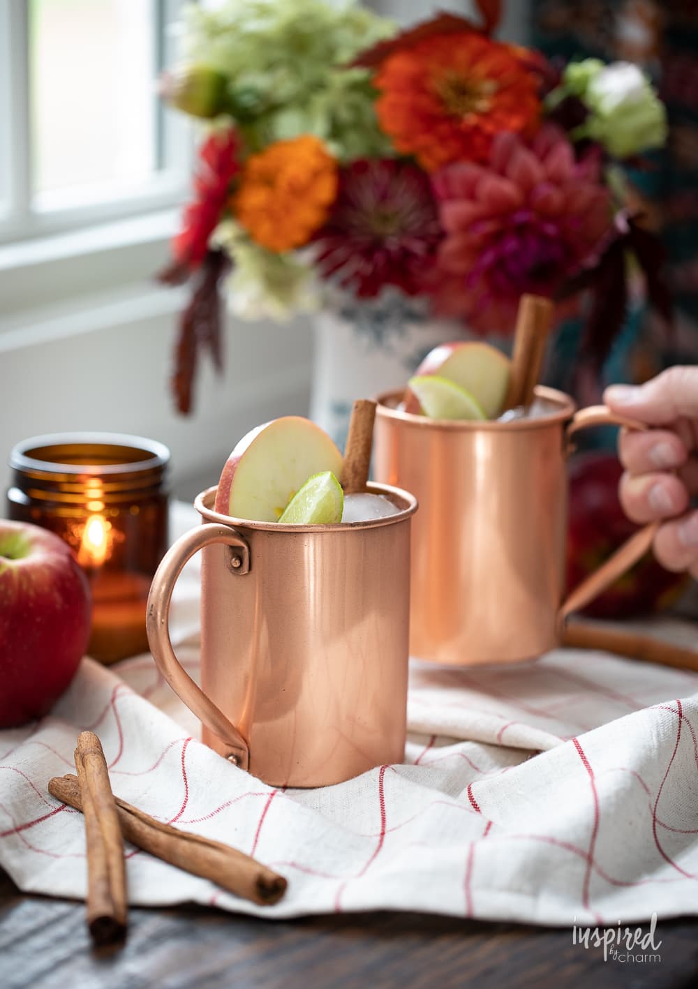 Caramel Apple Cider Moscow Mules in copper mugs.