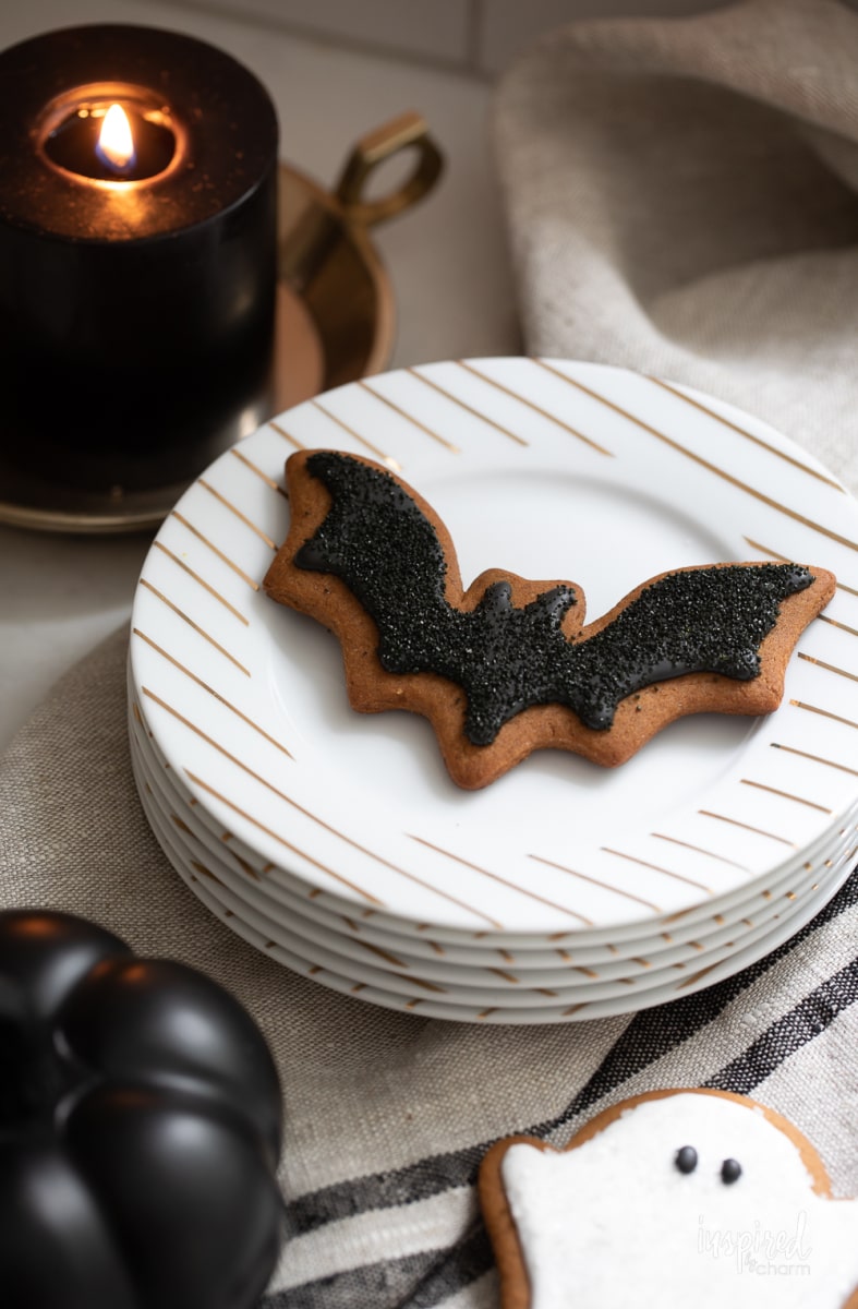 bat halloween gingerbread cookie on plate.
