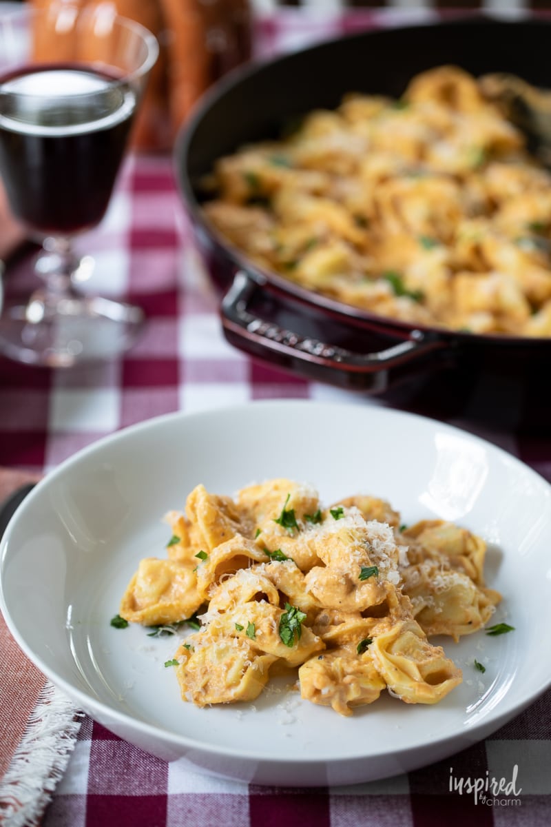 Creamy Pumpkin Tortellini served on a plate and in a pan.