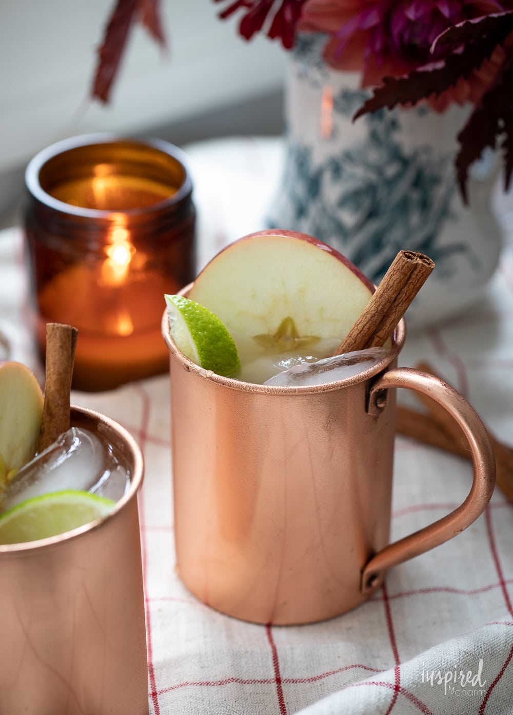 copper mug filled with caramel apple cider moscow mule.