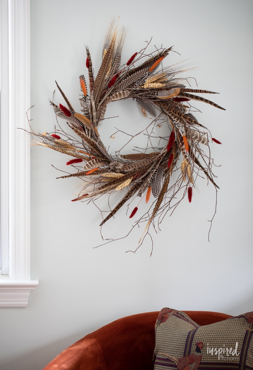DIY Feather Wreath for Fall on wall.