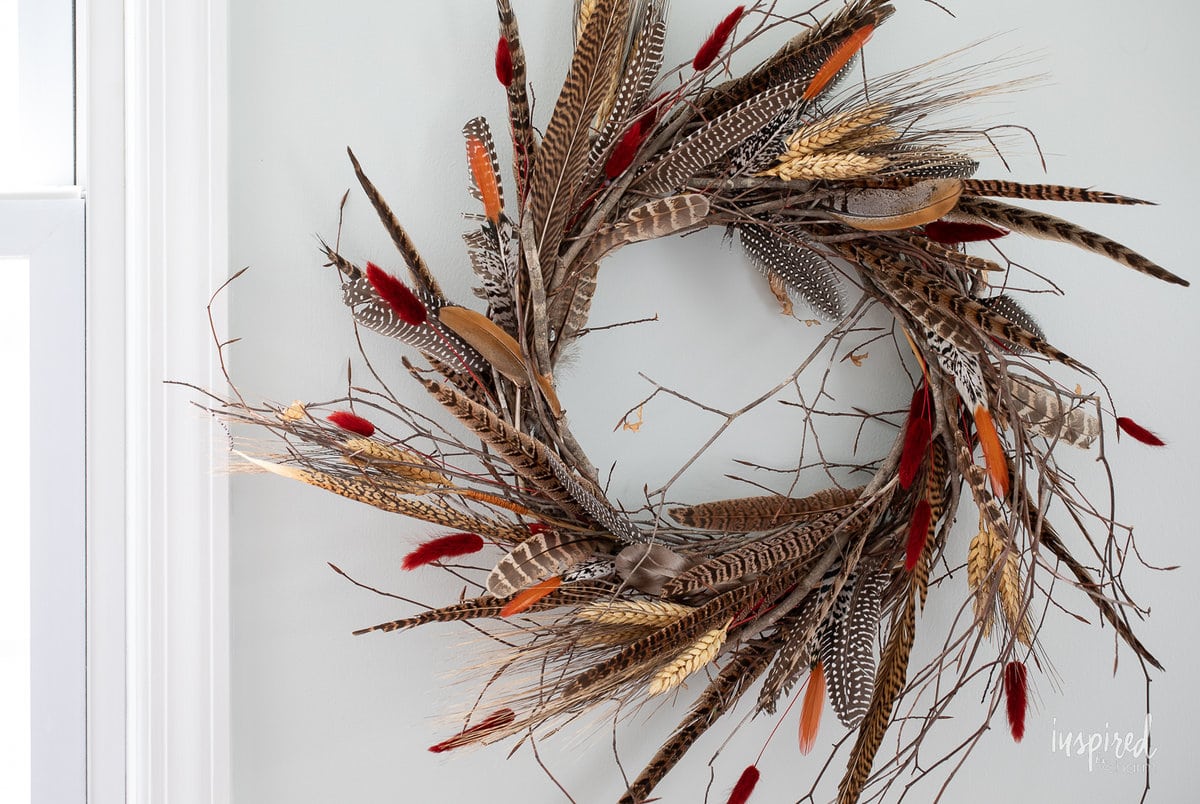 DIY Feather Wreath for Fall on wall.