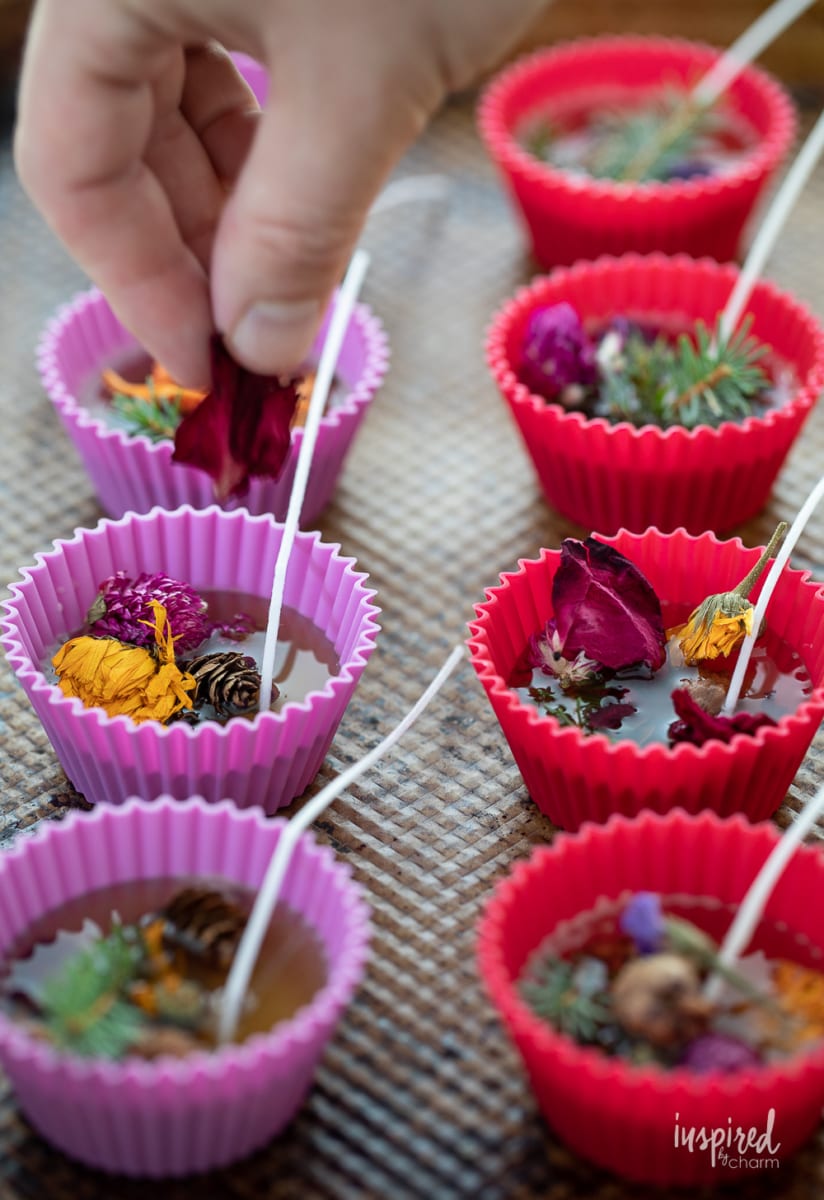 adding dried flowers to homemade fire starters.