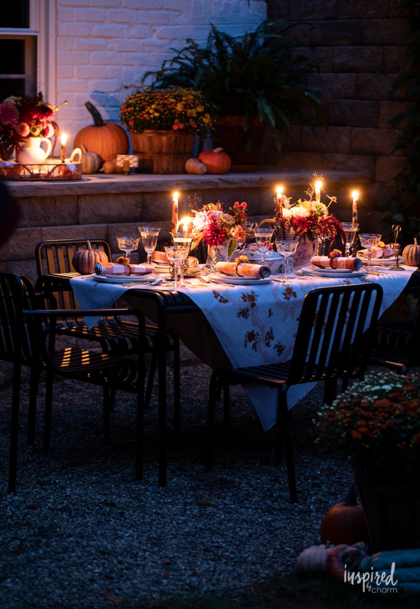 outdoor fall tablescape at night.