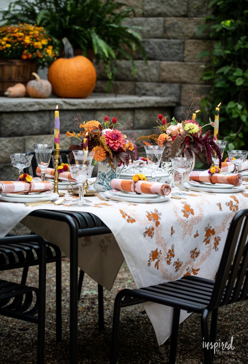 outdoor fall table with vintage table cloth.