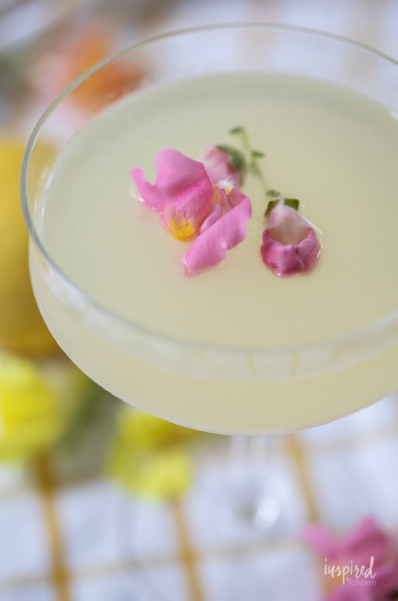 Limoncello Martinis in a glasse with flower garnish.